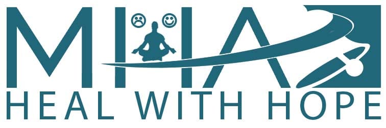 A person is sitting in the middle of a yoga pose.